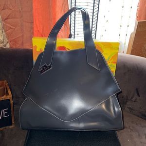 Cromia Italian leather purse/ bag, grey in color with white stitching.